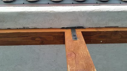 Wood expands and contracts while stucco does not and create small gaps that should be attended to overtime